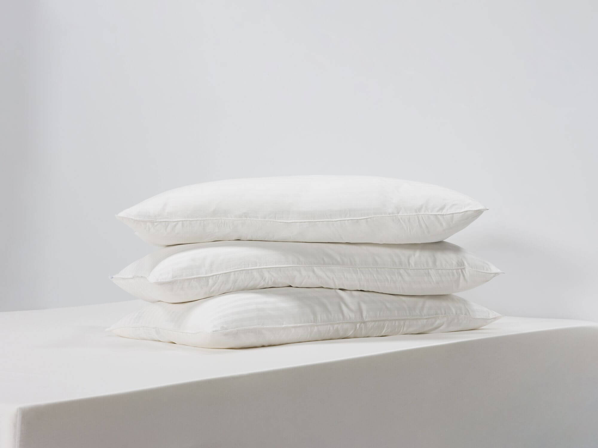 Three king down pillows side view